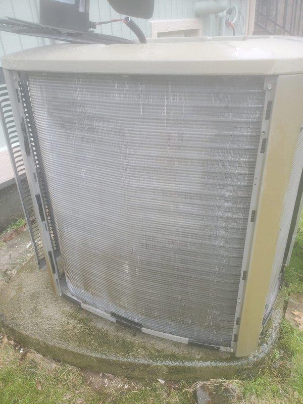 Completed comprehensive AC tune-up on 5-year-old outdoor condensing unit. Performed standard maintenance protocol including inspection of compressor, refrigerant lines, electrical connections, and condenser coil cleaning. Unit showing age-appropriate wear with minor dirt accumulation on coil fins and algae growth on pad; all components operating within normal parameters and system deemed ready for cooling season.