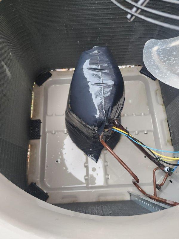 Completed scheduled preventive maintenance tune-up on residential cooling system. Performed comprehensive inspection of outdoor condenser unit, verifying proper operation of compressor, condenser fan motor, and electrical components. Checked refrigerant pressures, cleaned condenser coils, and confirmed adequate airflow through unit. Inspected indoor air handler, including blower assembly and condensate drain system. Applied protective covering to electrical connections as preventive measure against moisture intrusion. System tested and operating within normal parameters with no deficiencies noted. All components functioning properly at time of service completion.