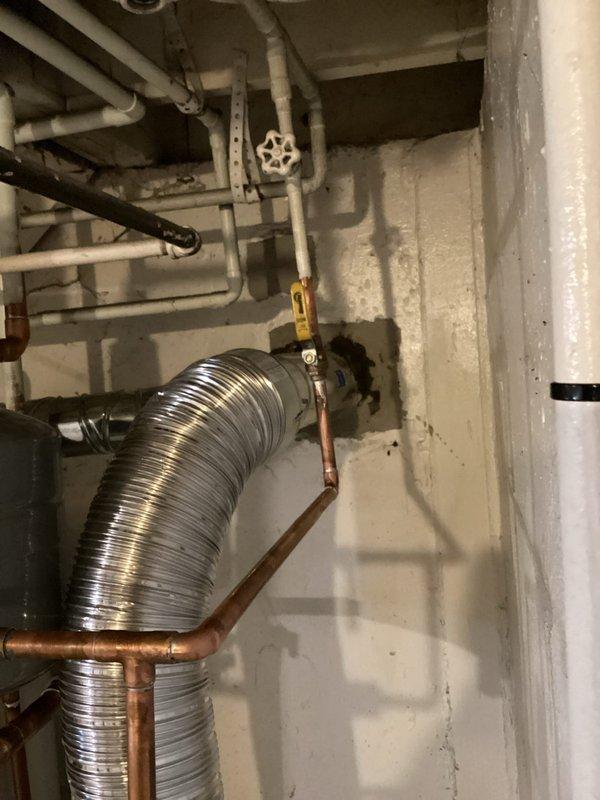 Responded to callback for pressure relief valve leak on recently installed boiler system. Inspected boiler installation, T6 thermostat, and chimney liner configuration. Verified all copper piping connections, pressure relief valve operation, and proper venting through flexible aluminum exhaust duct. Documented system condition with photos showing piping assembly, shutoff valves, and wall-mounted components. Advised customer of warranty coverage considerations and completed necessary paperwork for financed installation.