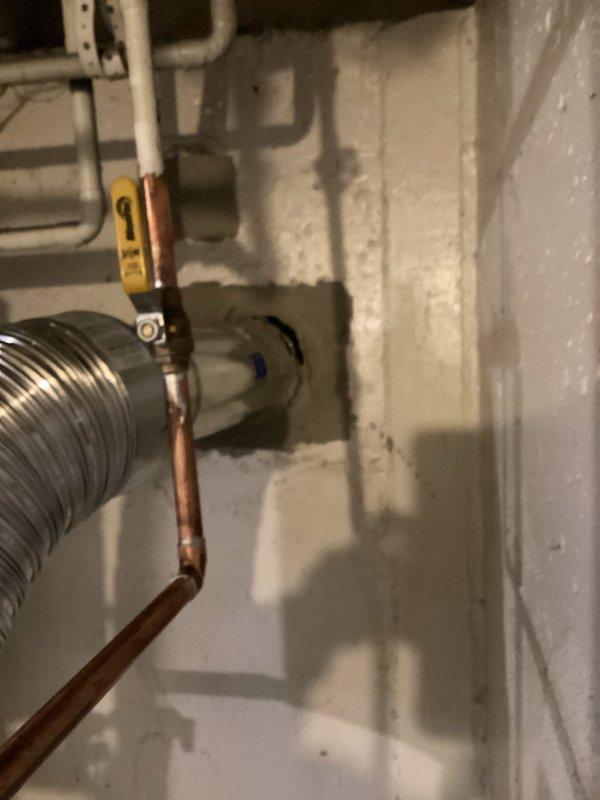 Responded to callback for pressure relief valve leak on recently installed boiler system. Inspected boiler installation, T6 thermostat, and chimney liner configuration. Verified all copper piping connections, pressure relief valve operation, and proper venting through flexible aluminum exhaust duct. Documented system condition with photos showing piping assembly, shutoff valves, and wall-mounted components. Advised customer of warranty coverage considerations and completed necessary paperwork for financed installation.