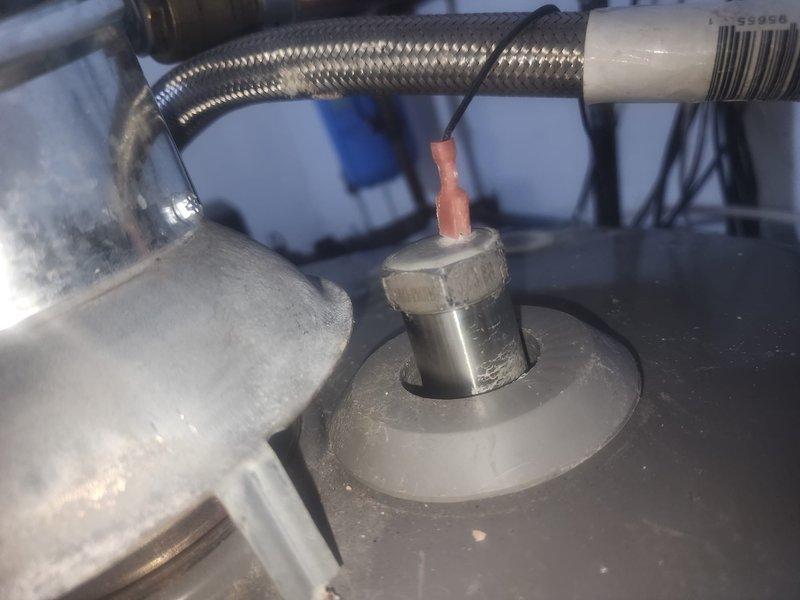 Responded to service call for loss of hot water in 50-year-old residence with water heater located in garage. Performed complete tank flush to remove sediment buildup, inspected anode rod for corrosion and deterioration, and verified all supply line connections and pressure relief valve operation. System restored to proper working order with hot water confirmed at all fixtures throughout the home.