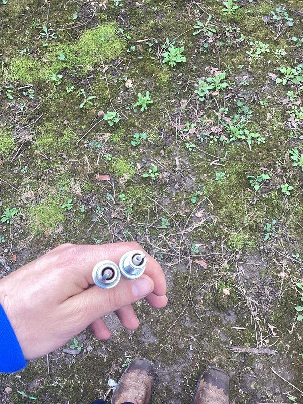 Performed scheduled maintenance on generator unit between 10-12pLVM. Conducted visual inspection of equipment and surrounding area. Removed loose hardware components found near generator base, including metal nuts and washers that had vibrated free during operation. Inspected generator mounting points and structural connections for additional loose fasteners. Documented equipment condition through photographs showing areas requiring attention, including weathered exterior panels and mounting hardware. Verified unit accessibility and cleared debris from immediate service area to ensure proper ventilation and safe operation.