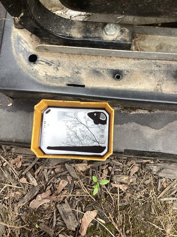 Performed scheduled maintenance on generator unit between 10-12pLVM. Conducted visual inspection of equipment and surrounding area. Removed loose hardware components found near generator base, including metal nuts and washers that had vibrated free during operation. Inspected generator mounting points and structural connections for additional loose fasteners. Documented equipment condition through photographs showing areas requiring attention, including weathered exterior panels and mounting hardware. Verified unit accessibility and cleared debris from immediate service area to ensure proper ventilation and safe operation.