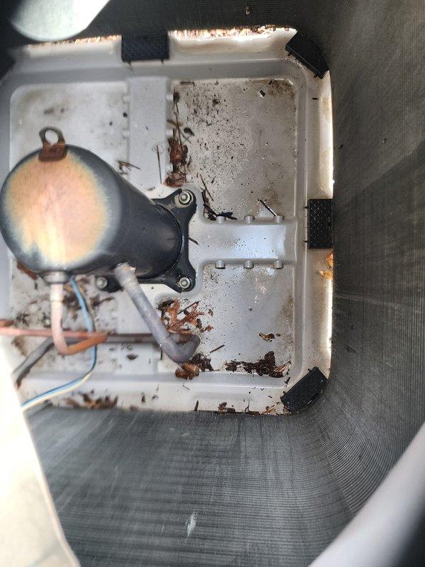 Completed scheduled preventive maintenance on two residential air conditioning systems. Performed comprehensive inspection of outdoor condenser units, including examination of electrical components, refrigerant line connections, and exterior housing conditions. Cleaned debris accumulation from electrical junction box, removing leaves, organic matter, and insect remains that had collected in the access panel. Verified proper operation of both systems and confirmed all components functioning within normal parameters.
