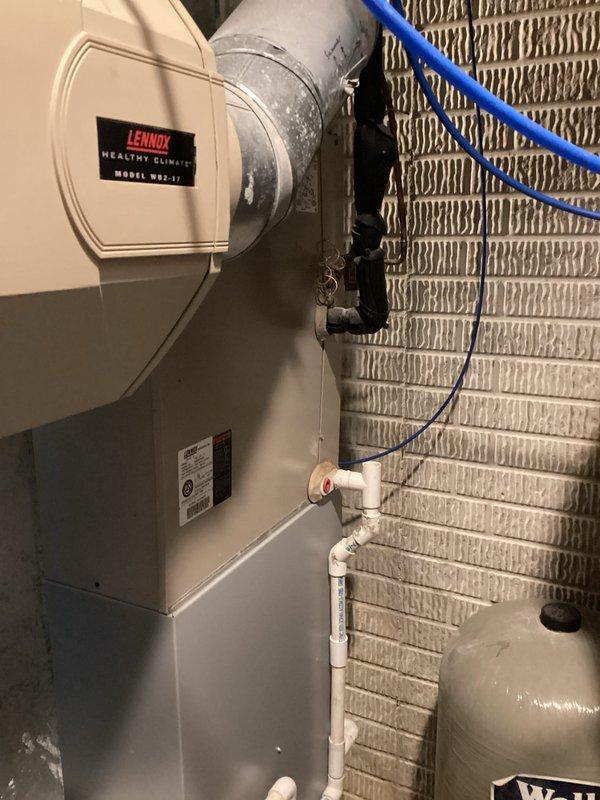 Provided comprehensive estimate for complete HVAC system replacement on 20-year-old equipment experiencing hard starting issues. Evaluated existing indoor components including Lennox humidifier, evaporator coil, and air handler located in basement utility area, along with outdoor condensing unit on exterior concrete pad. Documented current system configuration, ductwork connections, drainage systems, and electrical connections to develop replacement specifications for new high-efficiency heating and cooling equipment.