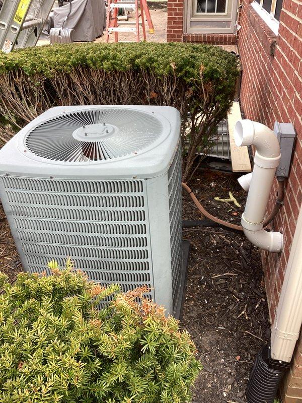 Conducted comprehensive assessment of existing 25-year-old residential air conditioning system for equipment replacement. Evaluated outdoor condenser unit positioned against brick exterior with existing refrigerant lines and condensate drainage system. Inspected indoor air handler and associated ductwork in basement utility area, including connections to water heater and gas lines. Provided detailed replacement estimate for complete AC system upgrade to address aging equipment and ensure optimal cooling performance.