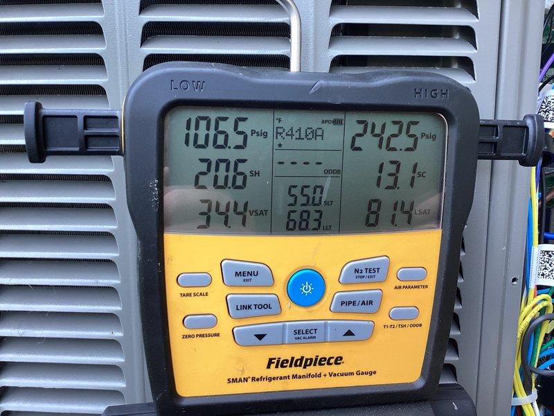 Completed system start-up on newly installed Lennox EL18KCV-036-230B04 air conditioning unit utilizing R-454B refrigerant. Verified operating pressures and temperatures using refrigerant manifold, confirming system charged to factory specifications of 7 lbs with proper superheat of 20.6°F on low side (106.5 PSIG) and subcooling of 13.1°F on high side (242.5 PSIG), indicating optimal refrigerant charge and system performance. Unit operational and ready for service.