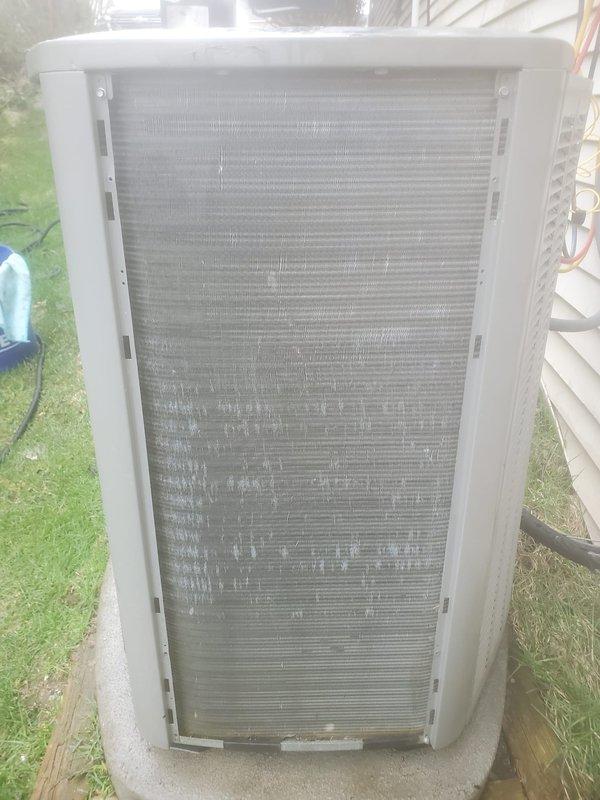 Completed routine preventive maintenance on residential air conditioning system under Worry Free Service Agreement. Inspection revealed significant dirt and debris accumulation on condenser coil fins with visible mold and mildew staining affecting heat transfer efficiency. Interior compartment showed corrosion and rust debris accumulation near refrigerant lines requiring attention. Performed standard maintenance protocol including system inspection, cleaning procedures, and operational verification to ensure optimal cooling performance for the season.