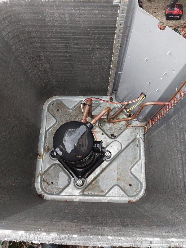 Completed fall/winter heating maintenance inspection on residential HVAC system. Performed thorough examination of outdoor condensing unit, including assessment of condenser coil fins, refrigerant line connections, and drain pan condition. Unit showed typical seasonal wear with minor debris accumulation on coil surfaces and standing water in drain pan. Copper refrigerant lines inspected and found intact with normal oxidation. Condenser mounted on proper pad with adequate clearance. All components operational and ready for heating season.