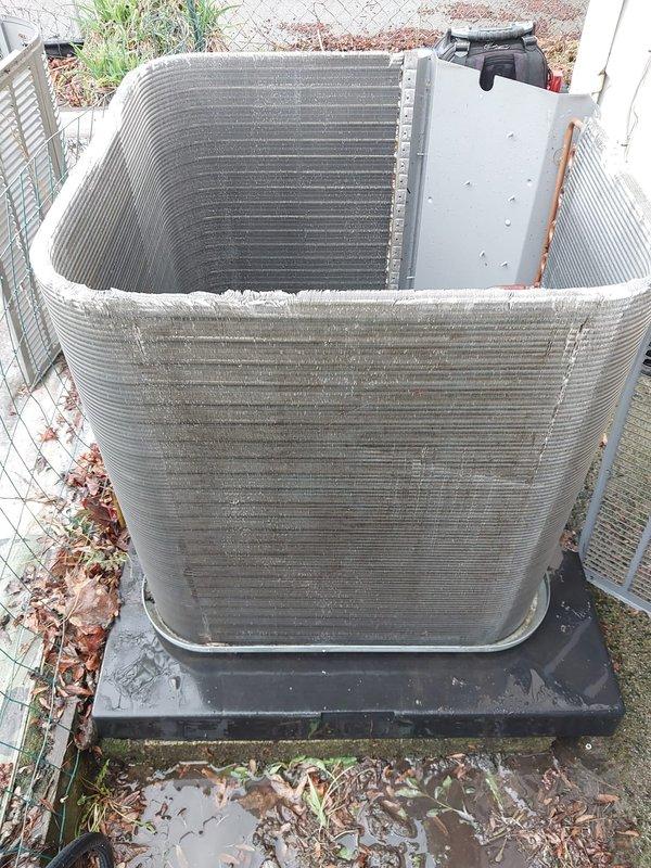 Completed fall/winter heating maintenance inspection on residential HVAC system. Performed thorough examination of outdoor condensing unit, including assessment of condenser coil fins, refrigerant line connections, and drain pan condition. Unit showed typical seasonal wear with minor debris accumulation on coil surfaces and standing water in drain pan. Copper refrigerant lines inspected and found intact with normal oxidation. Condenser mounted on proper pad with adequate clearance. All components operational and ready for heating season.