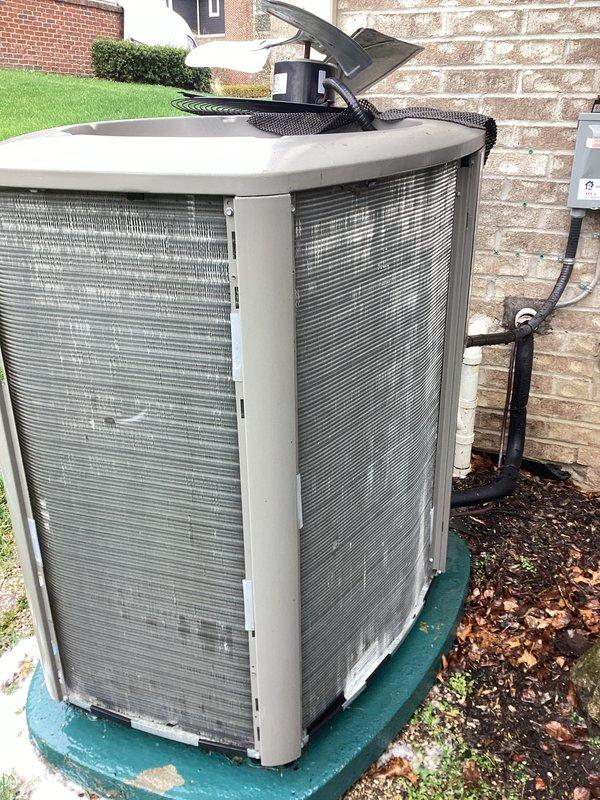 Completed annual AC maintenance on outdoor condensing unit located at rear west of property. Performed comprehensive tune-up including inspection of compressor, condenser coils, refrigerant lines, and electrical connections. Verified proper operation of fan motor and contactor, checked refrigerant line insulation integrity, and inspected condenser coil fins for damage or debris. All components found to be in satisfactory working condition with no immediate service needs identified. Unit operating within normal parameters.