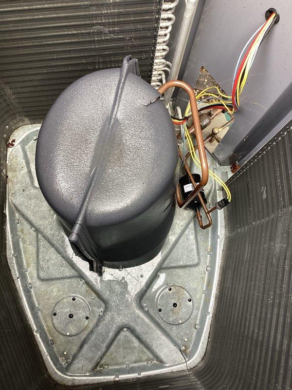 Completed annual AC maintenance on outdoor condensing unit located at rear west of property. Performed comprehensive tune-up including inspection of compressor, condenser coils, refrigerant lines, and electrical connections. Verified proper operation of fan motor and contactor, checked refrigerant line insulation integrity, and inspected condenser coil fins for damage or debris. All components found to be in satisfactory working condition with no immediate service needs identified. Unit operating within normal parameters.