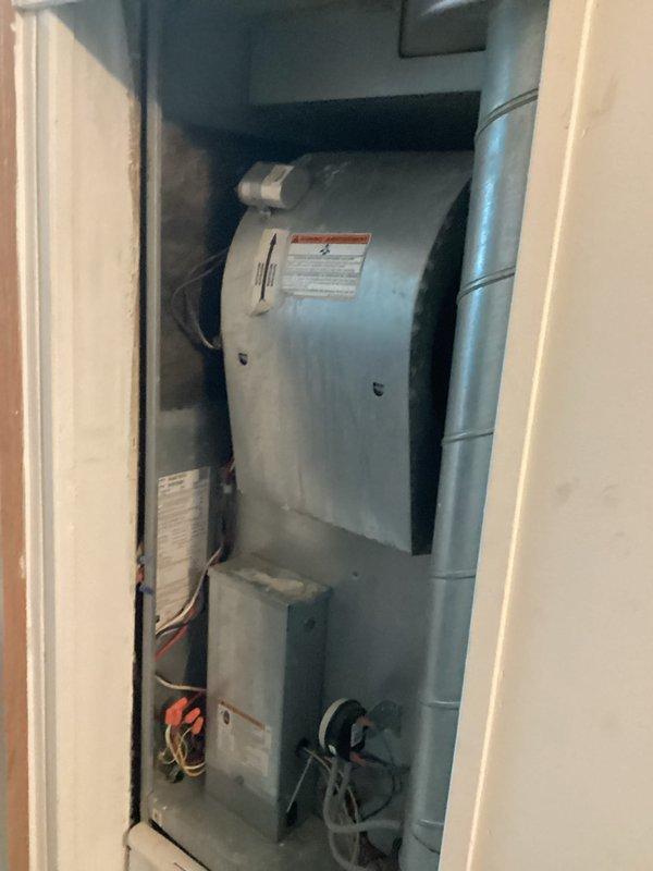 Provided estimate for replacement of aging outdoor air conditioning condenser unit located in backyard. Current system operational but experiencing intermittent shutoff issues. Assessed existing equipment condition, documented weathered tan-colored condenser with visible wear, and evaluated indoor air handler components housed in utility closet to determine complete system replacement specifications.