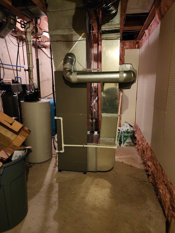 Completed full HVAC system installation in basement mechanical room, including new Lennox furnace, air conditioning unit, whole-home humidifier, and S40 smart thermostat. All equipment properly positioned, ductwork connected and sealed, electrical wiring completed, and system tested for optimal performance.