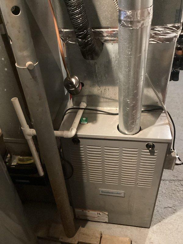 Provided estimate for complete HVAC system replacement including air conditioning unit and furnace located in basement area on northeast side of property. Existing 25-year-old equipment is non-operational and requires full replacement. Assessment included evaluation of current ductwork, refrigerant lines, condensate drainage system, and electrical connections to determine scope of installation work needed for new system.