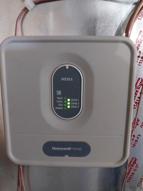 Performed seasonal maintenance inspection on residential HVAC system including furnace and air conditioning unit to verify proper operation of all components. Inspected Honeywell HZ311 zone control panel, confirming all three zones operational with heat, cool, fan, and purge functions displaying correct status indicators. Evaluated central air handler and outdoor condensing unit, checking refrigerant lines, drainage systems, and electrical connections. Provided customer education on proper maintenance procedures for Honeywell electronic air filter and completed thorough cleaning of filter media to restore optimal airflow and filtration efficiency. All equipment found to be operating within normal parameters with no deficiencies noted.