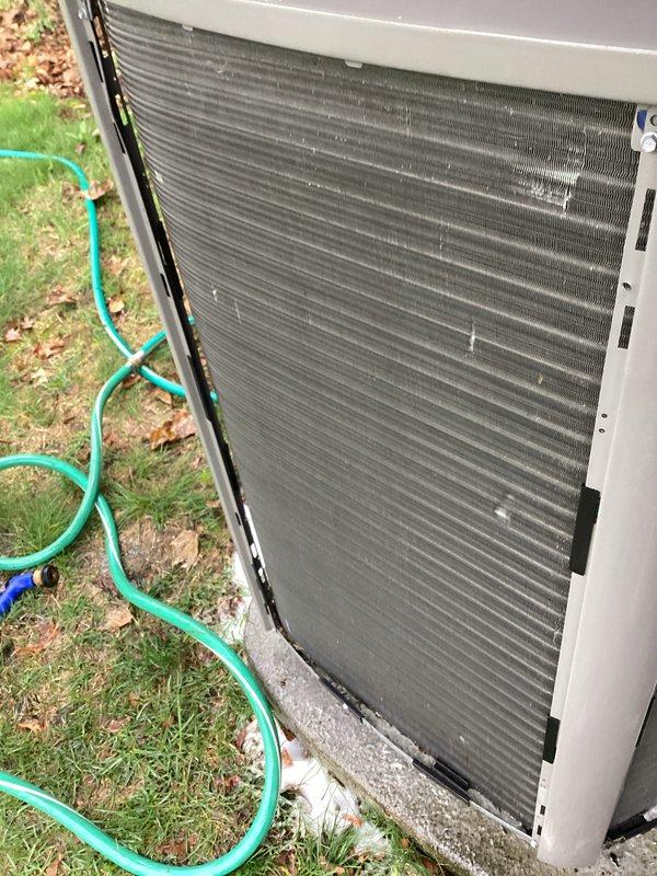 Completed preventive maintenance on residential split system air conditioning unit and ductless mini-split system. Performed thorough inspection of outdoor condenser unit, noting significant dirt and debris accumulation within condenser coil fins. Cleaned condenser coils to restore proper airflow and heat transfer efficiency. Inspected indoor air handler, observing dust buildup on evaporator coil surfaces and signs of corrosion on drain pan with visible water staining. Verified condensate drain system operation and electrical connections. All systems operational upon completion of maintenance service.