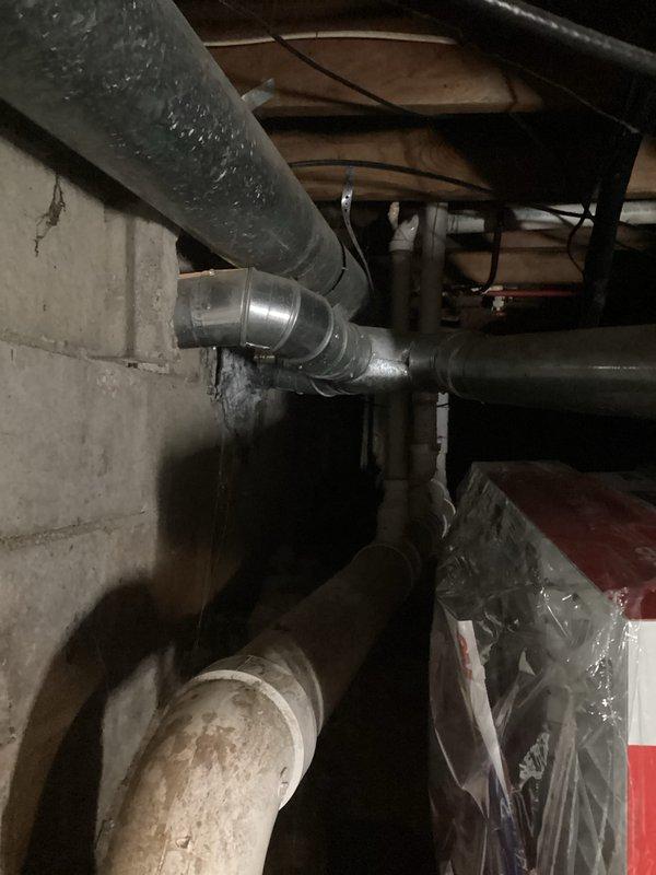 Provided comprehensive estimate for hot water heater replacement in residential basement utility area. Evaluated existing A.O. Smith water heater installation, including current plumbing configuration with copper and PEX connections, flue venting system, and adjacent water treatment equipment. Assessed utility space layout, existing infrastructure connections, and determined scope of work required for complete unit replacement while maintaining proper venting, code-compliant installation, and integration with existing water filtration system.