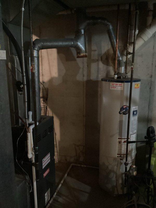 Conducted on-site assessment for HVAC system replacement quote CQ 03974-01, evaluating both full system and single system replacement options. Documented existing equipment including outdoor condenser unit with horizontal louver design and basement furnace installation, photographing current system configuration, electrical connections, ductwork routing, and equipment placement to provide accurate replacement specifications and multiple pricing options for customer consideration.