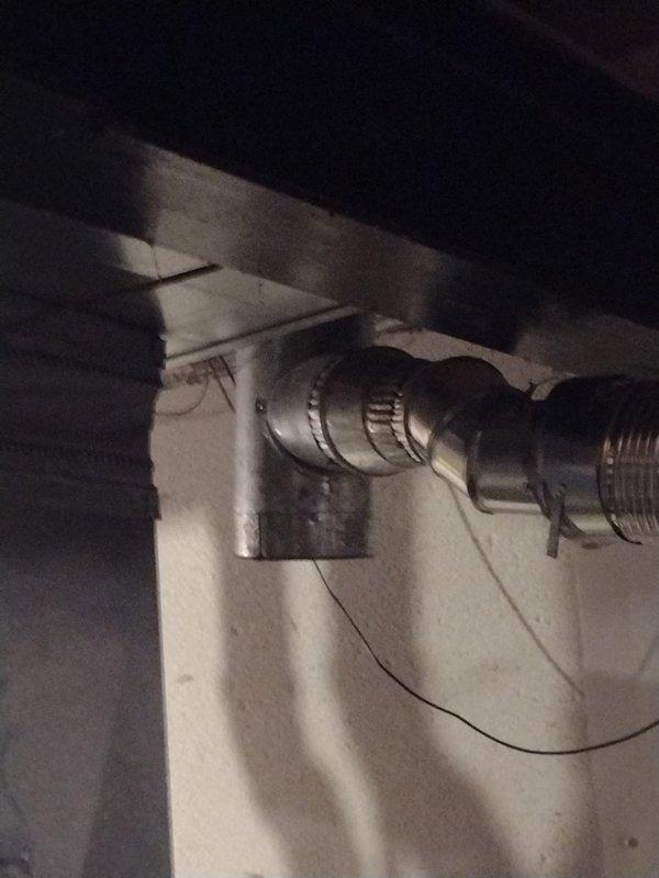 Completed installation of a 50-gallon tanked water heater in basement utility area. Installed new unit with proper connections including hot and cold water supply lines, pressure relief valve piping, and venting system using flexible metallic ductwork routed to existing exhaust path. Mounted blue expansion tank to wall with appropriate support brackets and connected to water supply system to accommodate thermal expansion. All plumbing connections secured with code-compliant fittings, and system tested for proper operation and leak-free performance.