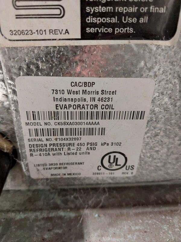 Responded to service call for furnace squealing on startup. Upon arrival, inspected Carrier 50CVA070 furnace unit manufactured August 2002. Diagnosed squealing noise as worn inducer motor bearings causing friction during startup cycle. Documented equipment specifications and current operating conditions through photographic record of unit data plates. Evaporator coil model CK6BXA030014AAAA confirmed compatible with R-410A refrigerant system. Recommended inducer motor assembly replacement to eliminate noise and prevent potential startup failure. Unit currently operational but requires prompt attention to avoid complete motor failure and loss of heating capability.
