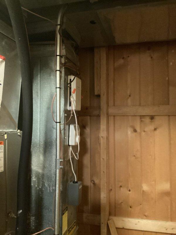 Provided comprehensive heat pump replacement estimate for 17-year-old system experiencing defrost control board failure. Assessed existing outdoor condenser unit with vegetation encroachment issues and indoor air handler installation, documenting equipment condition and recommending full system replacement due to age and component failure.