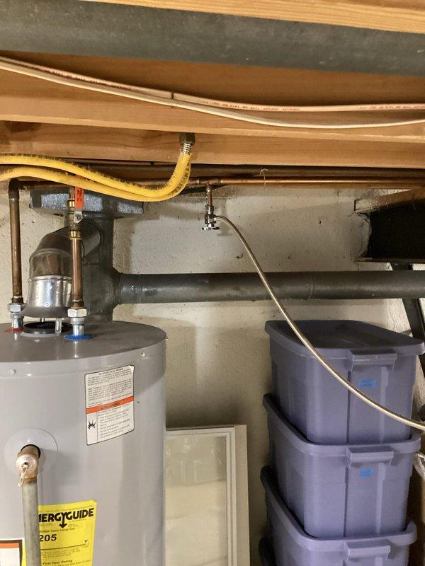 Completed furnace replacement estimate for residential basement installation. Assessed existing beige/tan furnace unit with metallic silver air handler, documented current HVAC configuration including ductwork with reflective insulation, and evaluated mechanical room layout accommodating water heater and laundry appliances. Provided comprehensive replacement quote for 10-12 SEER system within expedited timeframe to meet occupant scheduling requirements.