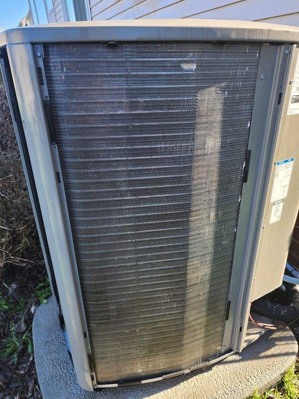 Completed routine maintenance on residential air conditioning system. Inspected outdoor condenser unit, noting significant dirt and debris accumulation on coil fins requiring cleaning for optimal heat transfer efficiency. Examined internal components including condenser fan motor, blades, and electrical connections, verifying proper operation and mechanical integrity of all accessible parts.