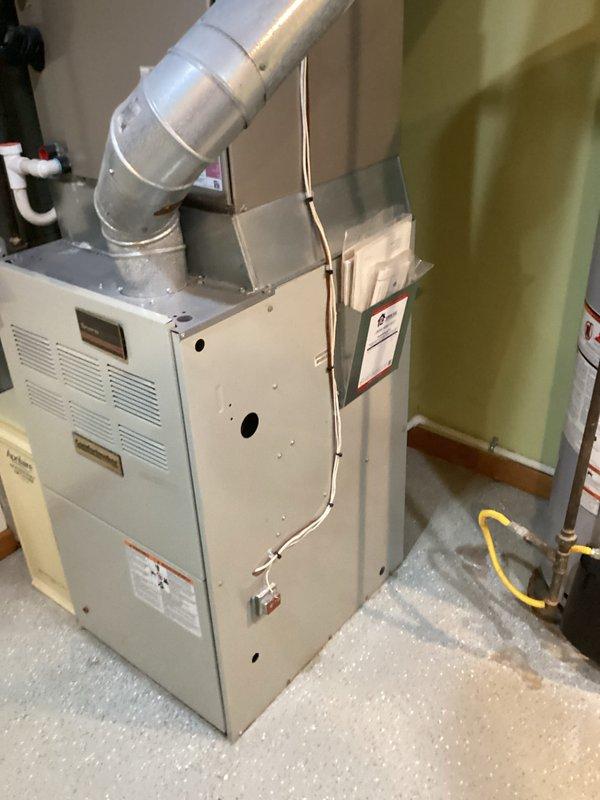 Conducted comprehensive estimate for complete HVAC system replacement in residential basement utility room. Evaluated existing furnace, air handler, and humidifier equipment for replacement specifications. Documented current system configuration including ductwork connections, gas line routing, PVC drainage system, and electrical connections to provide accurate replacement proposal.