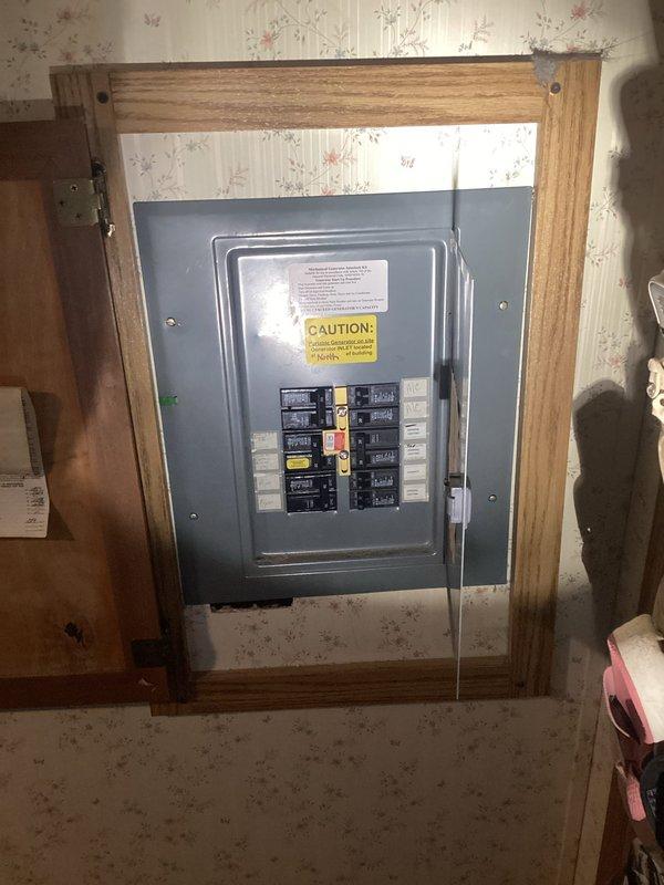 Installed mechanical interlock kit on main electrical panel and mounted 30-amp power inlet box on exterior wall to enable safe backup generator connection during utility outages. Replaced standard breakers with tandem breakers to accommodate new generator backfeed breaker, installed exterior-rated cable routed through crawlspace to inlet location near shed area, and verified proper interlock operation to prevent backfeeding utility lines.