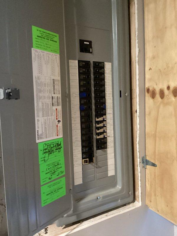Conducted comprehensive HVAC system evaluation for complete replacement estimate. Assessed existing outdoor condensing unit positioned on concrete pad against home exterior, including electrical disconnect, refrigerant line set routing, and condensate drainage configuration. Documented current electrical service panel with existing circuit breaker configuration to determine compatibility requirements for new equipment installation.