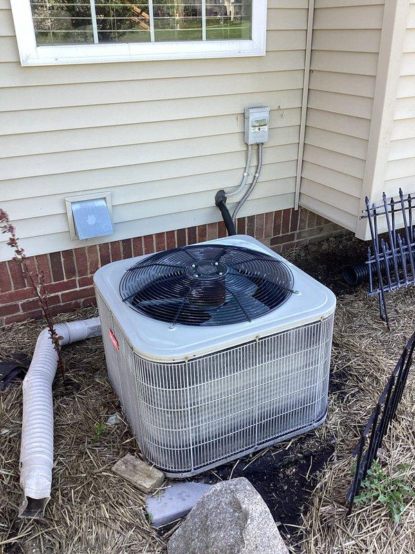 Conducted comprehensive HVAC system evaluation for complete replacement estimate. Assessed existing outdoor condensing unit positioned on concrete pad against home exterior, including electrical disconnect, refrigerant line set routing, and condensate drainage configuration. Documented current electrical service panel with existing circuit breaker configuration to determine compatibility requirements for new equipment installation.