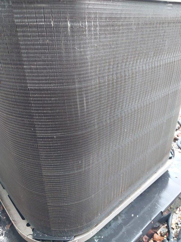 Completed routine air conditioning maintenance per Worry Free Service Agreement cooling protocol. Performed comprehensive inspection of indoor blower motor assembly, verified electrical connections and wiring integrity, and examined refrigerant line connections. Outdoor condenser unit inspected and documented with significant dirt and debris accumulation noted on coil fins requiring attention to maintain optimal heat transfer efficiency and system performance.
