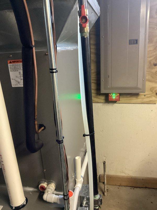 Provided estimate for complete HVAC system replacement in residential basement mechanical room. Assessed existing Lennox furnace installation with current PVC venting configuration, copper refrigerant lines, and electrical connections to determine replacement specifications and requirements for new equipment installation.
