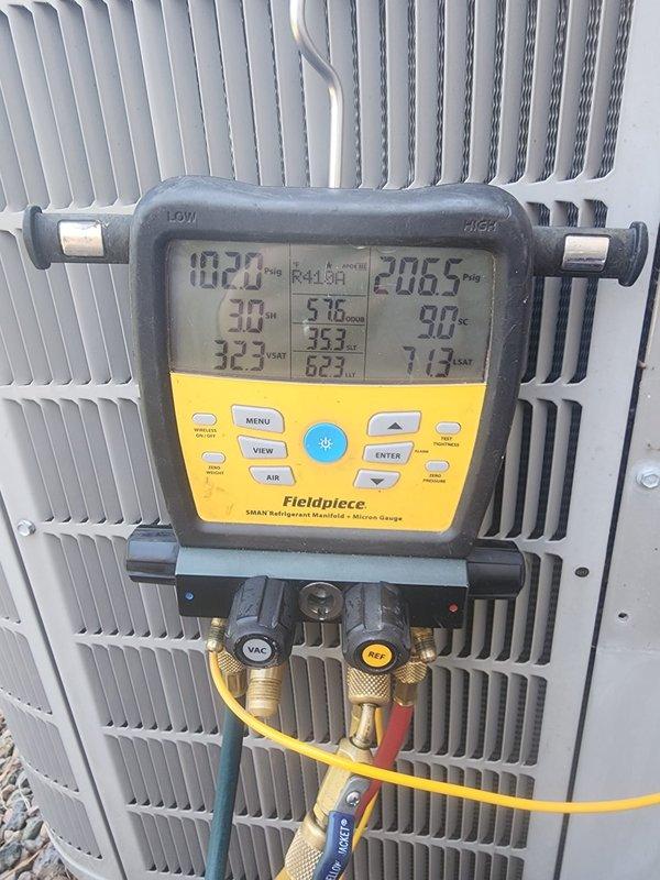 Completed comprehensive maintenance service on residential HVAC system, tankless water heater, and backup generator unit. Performed thorough AC system inspection utilizing digital manifold gauge to verify refrigerant pressures and temperatures across the system, with all readings within manufacturer specifications. Condenser unit exterior inspected and found in good operational condition with clean coil fins and proper airflow through protective grille assembly. All three systems serviced according to prepaid maintenance agreement specifications.