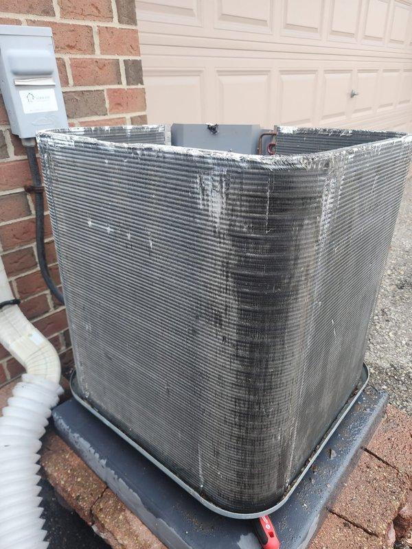 Completed comprehensive preventive maintenance service on a six-year-old outdoor air conditioning condenser unit as part of annual Worry Free Service Agreement. Performed full system inspection including compressor operation, refrigerant lines, electrical connections, and condenser coil condition. All components found operating within normal parameters with no deficiencies noted. Unit properly secured on vibration-dampening pad with appropriate clearances maintained. Documented system condition with photographs for service records.