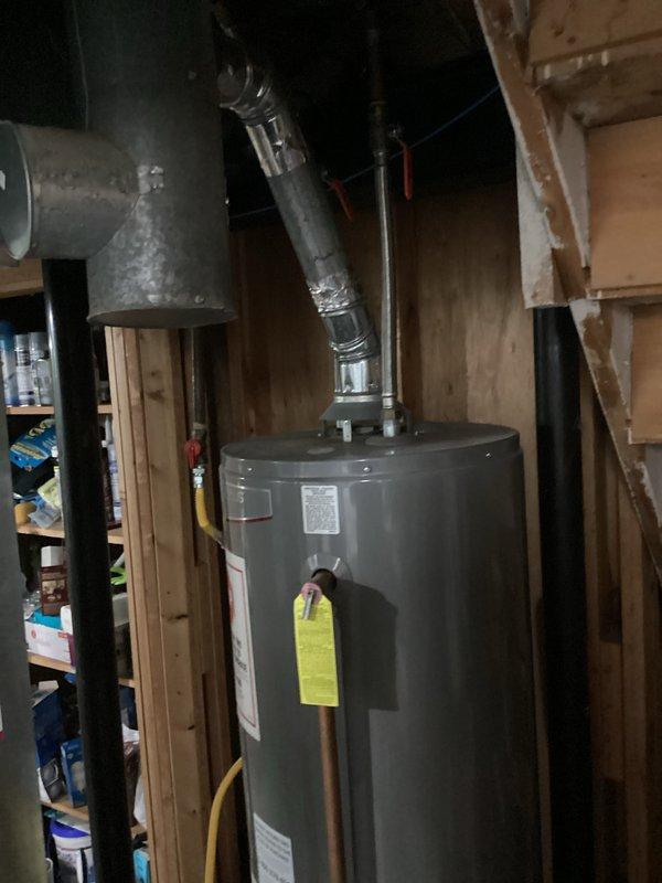 Completed comprehensive HVAC system replacement estimate following identification of failed heat exchanger. Assessed existing furnace unit with compromised heat exchanger presenting safety concerns, documented extensive condensation formation on ductwork indicating potential system inefficiency, and evaluated water heater installation in mechanical room. Provided detailed replacement options under quote numbers 03999-04 and 03999-02 for complete system upgrade to ensure safe and efficient heating operation.