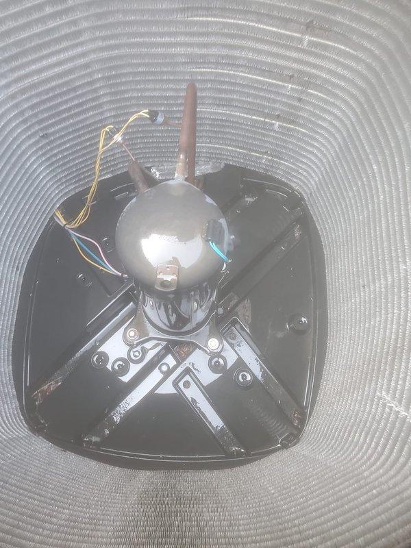 Performed routine air conditioning maintenance and inspection. Documented ceiling-mounted HVAC components including motor assembly, electrical connections, and flexible ductwork to verify proper installation and operation.