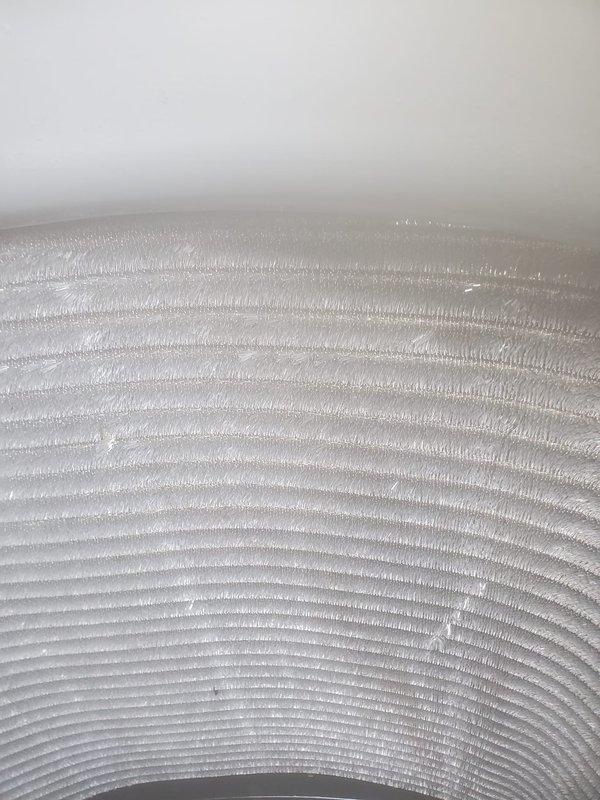 Performed routine air conditioning maintenance and inspection. Documented ceiling-mounted HVAC components including motor assembly, electrical connections, and flexible ductwork to verify proper installation and operation.
