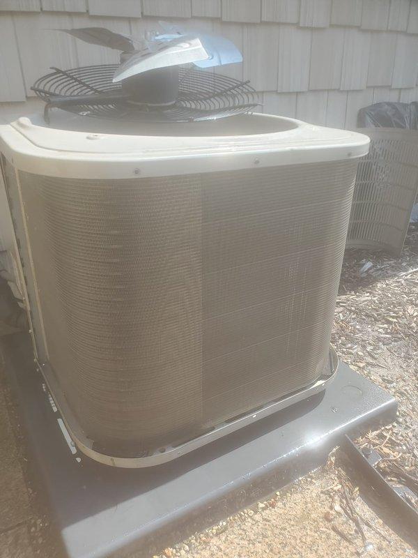 Completed scheduled air conditioning maintenance on outdoor condensing unit and indoor air handler. Performed visual inspection of condensing unit exterior, verified fan operation and protective grille integrity, and confirmed unit was mounted securely on concrete pad. Inspected internal components of air handler including blower assembly, electrical connections, and ductwork connections to ensure proper operation and system readiness.