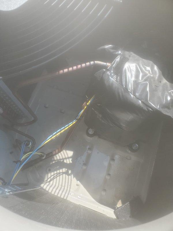 Completed scheduled air conditioning maintenance on outdoor condensing unit and indoor air handler. Performed visual inspection of condensing unit exterior, verified fan operation and protective grille integrity, and confirmed unit was mounted securely on concrete pad. Inspected internal components of air handler including blower assembly, electrical connections, and ductwork connections to ensure proper operation and system readiness.