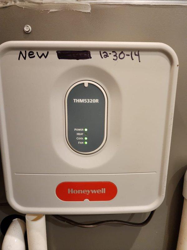 Completed installation of Lennox air conditioning system including new air handler unit and Honeywell THM5320R thermostat. System was installed, tested, and verified operational with proper condensate drainage lines and electrical connections in place.