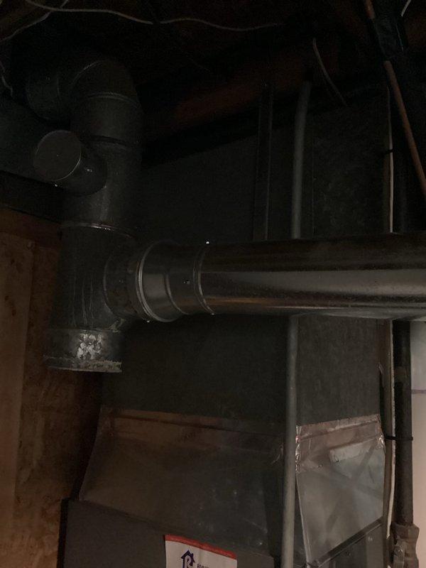 Responded to emergency water heater failure that resulted in complete tank discharge flooding the basement. Conducted on-site assessment of the failed unit, documented existing installation including venting configuration and plumbing connections, and photographed the water heater and surrounding mechanical equipment. Provided comprehensive quote for water heater replacement including removal of failed unit and installation of new system with proper venting and code-compliant connections.