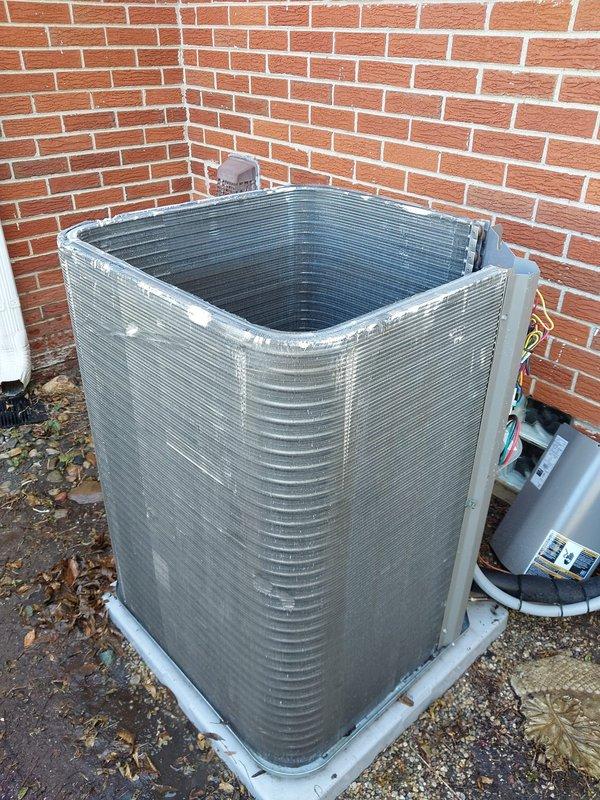 Completed seasonal cooling maintenance and tune-up on residential split-system air conditioning unit. System was operational upon arrival and confirmed working properly throughout service. Performed comprehensive inspection of outdoor condenser unit, including examination of aluminum fin condition, refrigerant line connections, and electrical components. Documented moderate surface rust and corrosion present on interior base pan, though not affecting current system operation. Verified compressor function, refrigerant line integrity, and proper electrical connections. System left in good working order with seasonal maintenance completed per prepaid service agreement.