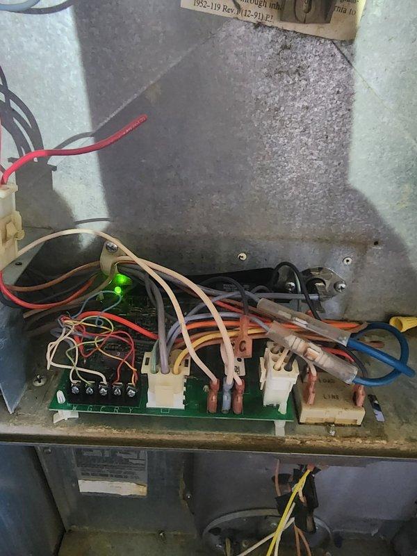 Responded to no air conditioning call with no airflow from system. Upon inspection, accessed control board cabinet and found issue related to previous October repair where system had no blower operation. Examined green control board with TIANBO HJQ-15F-S-H relays and verified power present via illuminated LED indicator. Diagnosed and repaired faulty relay or control circuit affecting air conditioning operation, tested all wire connections and terminal points, and confirmed system restored to proper cooling operation with adequate airflow.