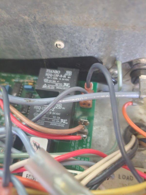 Responded to no air conditioning call with no airflow from system. Upon inspection, accessed control board cabinet and found issue related to previous October repair where system had no blower operation. Examined green control board with TIANBO HJQ-15F-S-H relays and verified power present via illuminated LED indicator. Diagnosed and repaired faulty relay or control circuit affecting air conditioning operation, tested all wire connections and terminal points, and confirmed system restored to proper cooling operation with adequate airflow.