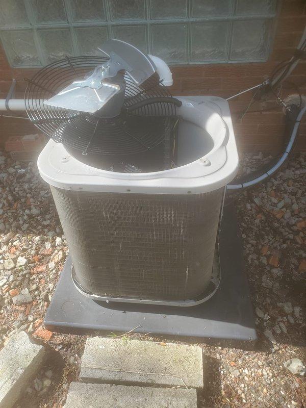 Completed routine maintenance on a 6-year-old residential air conditioning system. Performed comprehensive tune-up including inspection of outdoor condensing unit, fan assembly, and motor compartment. Verified proper operation of condenser fan with protective grille, checked refrigerant line insulation integrity, and inspected electrical connections including control wiring. Cleaned unit components, examined blower assembly, and confirmed system is operating within manufacturer specifications for the cooling season.