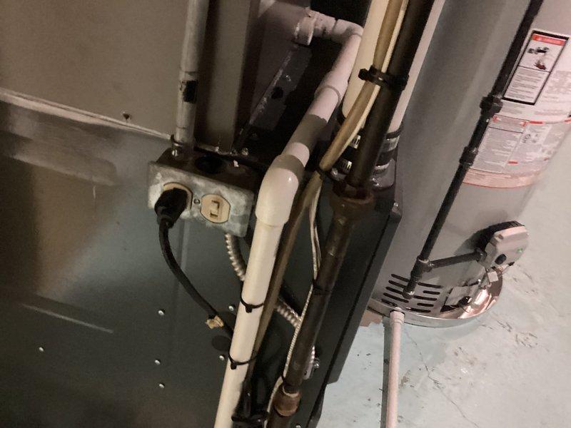 Completed installation of 50-gallon tanked water heater in basement mechanical room. Unit was professionally mounted, connected to existing water supply lines, and integrated with proper drainage system using PVC piping. All electrical connections were made to code with appropriate junction box and power supply, and the system was tested for proper operation and leak-free performance.