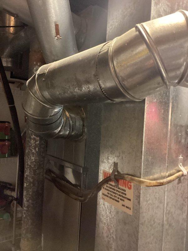 Provided estimate for complete replacement of 15-year-old air conditioning and furnace system located in basement mechanical room. Current air conditioning unit is non-operational while furnace remains functional. Assessed existing natural gas furnace installation and accompanying ductwork system, including horizontal main trunk line with elbow joint and vertical connections, to determine specifications for replacement equipment and compatibility with current infrastructure.