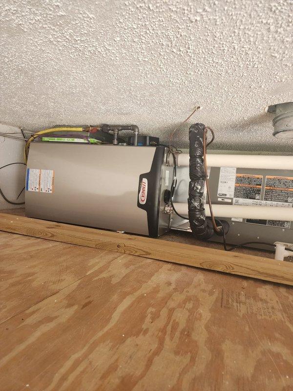 Completed site assessment for residential HVAC system experiencing freezing issues with concentric venting. Separated intake and exhaust venting through roof to eliminate freezing condition caused by improper concentric vent configuration. Installed independent intake and exhaust terminations to ensure proper combustion air supply and prevent moisture accumulation that was causing the 1-3 pipe freezing issue.